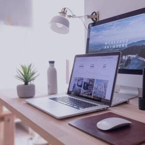 Modern office desk setup showing digital growth metrics by PixelHunts—offering the best digital marketing in Vizag.